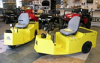 Two Yellow Golf Carts for sale in Golf Cart Center, Rockledge, Florida